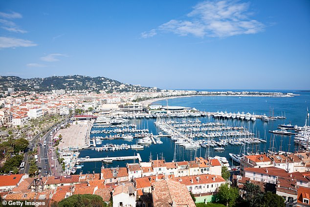 Sipping champagne on a yacht in Cannes, France inspired a passage in her novel. Stock image used