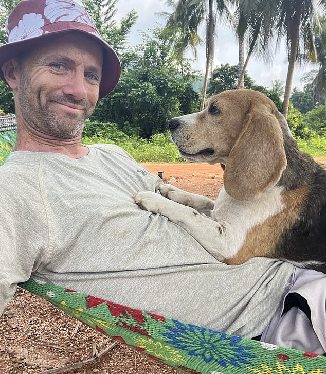 His recovery, which took a year, mostly involved long walks in the jungle with Snoop. On his walks he became aware of how many stray dogs were on the island: tens of thousands, he estimates. Pictured with Beagle McMuffin